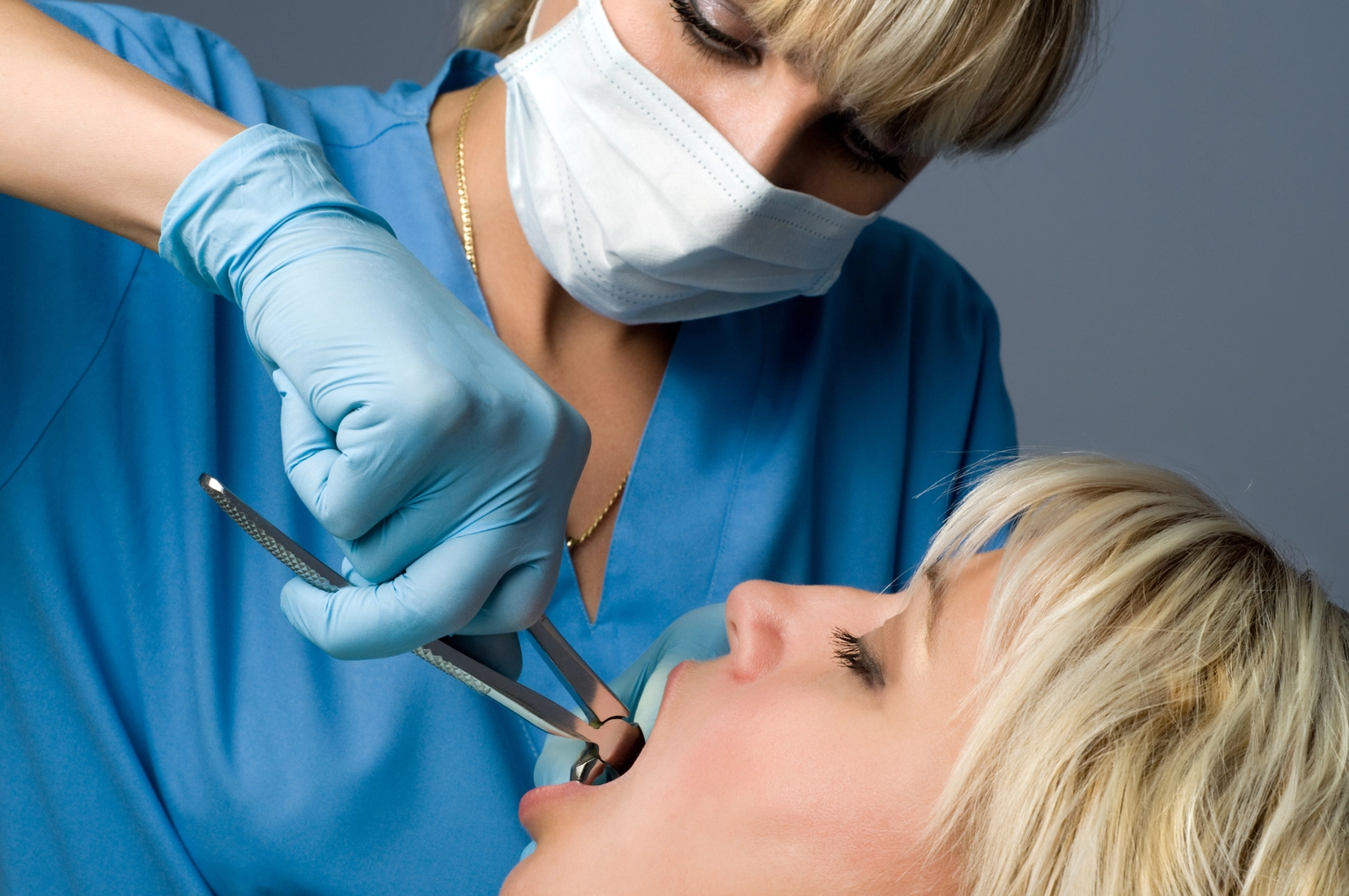 What Is Dry Socket? An oral surgeon performing a tooth extraction.
